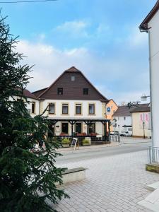 a large building on a street in a town at Maximo am Königsberg in Wolfstein