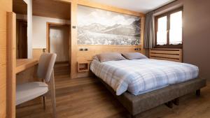 Postel nebo postele na pokoji v ubytování Hotel Compagnoni