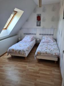 Postel nebo postele na pokoji v ubytování gîte Brocéliande - Closeries du Golfe
