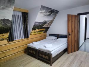 Postel nebo postele na pokoji v ubytování Willa Bafijówka
