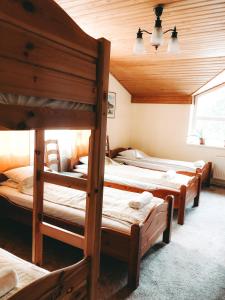 a group of four bunk beds in a room at Strenči Guesthouse & SPA in Strenči