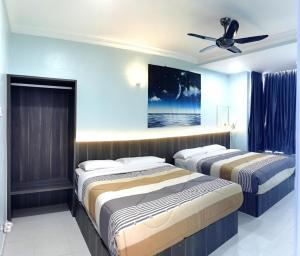 Voodi või voodid majutusasutuse Goodlife Paradise @ Emerald Avenue Premium Apartments toas