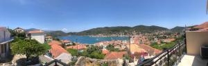 a view of a town with a lake and buildings at Panoramic View Villa in Vathi, Ithaka