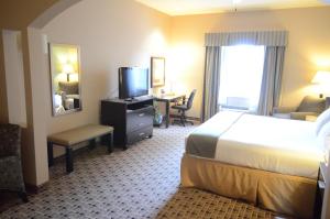 Postel nebo postele na pokoji v ubytování Aspen Grand Hotel Houston