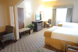 Postel nebo postele na pokoji v ubytování Aspen Grand Hotel Houston