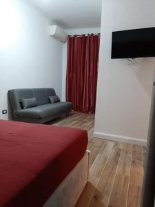 A television and/or entertainment centre at Appartamento ALECATIA 2