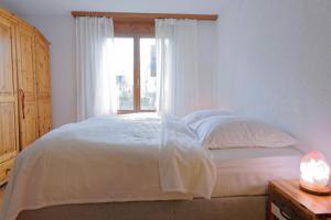 Postel nebo postele na pokoji v ubytování 2 rooms Appartment "Home, Swiss Home"