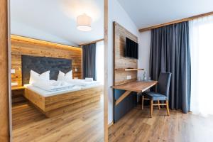 Tempat tidur dalam kamar di Heufelder Hof
