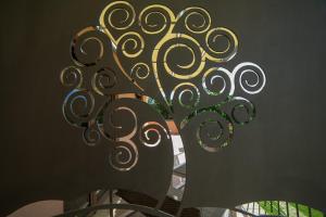 a metal object with swirls on a wall at Al Boschetto in Scario