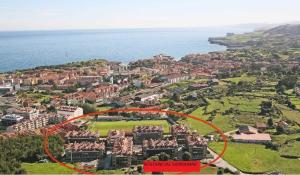 an aerial view of a city with a red circle at Apartamento Llanes Mar y Monte in Llanes