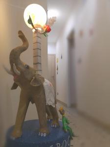 a statue of an elephant with its trunk in the air at La Dimora del Principe - Appartamento in Catania