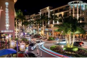 a busy city street at night with cars parked at Naples Dream at WTC with Heated Pool SPA Sauna 7 bicycles and 3 mls to beach in Naples