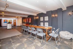 a dining room with a table and chairs at higgihaus #5 Sleeps 14-16 Hens Stags Big Groups in Cardiff