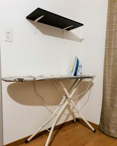 a desk with a computer on top of it at Private Bed in a Shared Spacious Apartment in St. Gallen