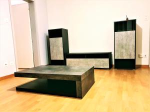 two benches in a room with a wooden floor at Private Bed in a Shared Spacious Apartment in St. Gallen