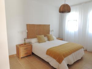 A bed or beds in a room at COZY, Beach House , by MAHBOVILLAS Még 37 kép