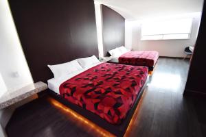 Tempat tidur dalam kamar di Hotel Via La Villa