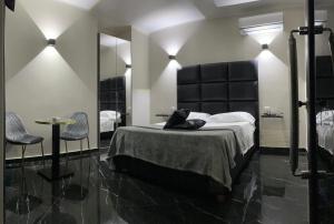 Postel nebo postele na pokoji v ubytování Hotel Trionfal + 37 fotografií