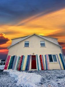a house with colorful books on the side of it at The Bookstore Family Apartment in Hellissandur