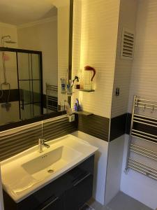 a bathroom with a sink and a mirror at Villa Göcek in Göcek