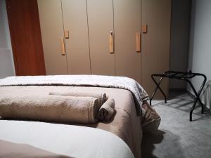 A bed or beds in a room at AGAS Exclusive Apartment