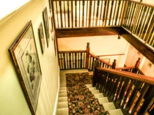 an overhead view of a staircase in a house at Toorak Manor Hotel in Melbourne
