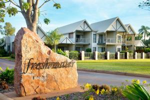 a house that has a sign on the side of it at Freshwater East Kimberley Apartments in Kununurra