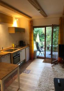 a kitchen with a sink and a stove top oven at Top Apartment 3 in Rosengarten/Hamburg in Rosengarten