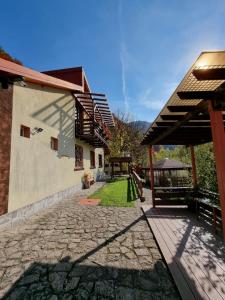 a courtyard of a house with a stone walkway at Casa Teodora in Sinaia