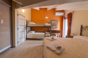 A bed or beds in a room at Gold Olive Suites by "elite"