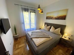 Postel nebo postele na pokoji v ubytování MonteRelax Apartments Becici
