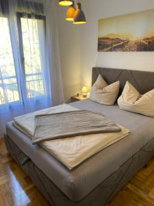 Postel nebo postele na pokoji v ubytování MonteRelax Apartments Becici