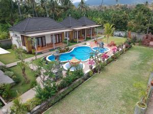 an aerial view of a house with a swimming pool at Villa Umah Didua in Lovina