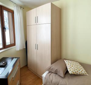 A bed or beds in a room at Ski Area 202 apt, The Castle 1, Pamporovo