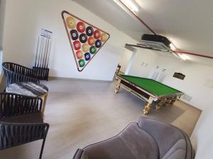 a living room with a pool table and a dart board at 16 Forest City homestay-free WIFI-森林城市民宿 in Johor Bahru