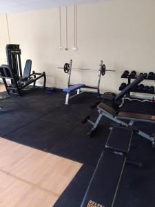 a gym with several treadmills and weights at Apartamento en puerta valle Ricote y Archena in Villanueva de Río Segura
