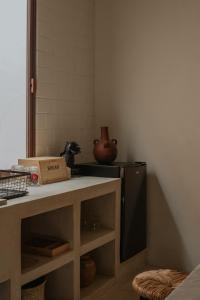 a kitchen with a counter with a box on it at Narrativ Lofts -Solario- Charming Historic Escape in Campeche