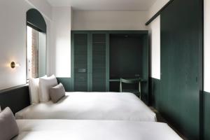 Postel nebo postele na pokoji v ubytování DDD HOTEL