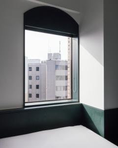 Postel nebo postele na pokoji v ubytování DDD HOTEL