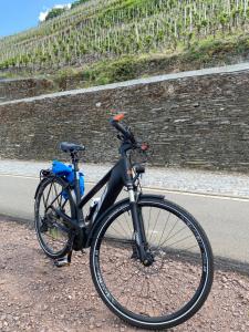 a bike parked on the side of a road at Fewo Rheinwein 1 "ausgezeichnet zum wandern und radfahren" mit Wallbox in Boppard
