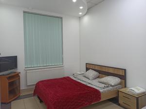 Postel nebo postele na pokoji v ubytování Старий Дворик,кімнати біля жд вокзалу