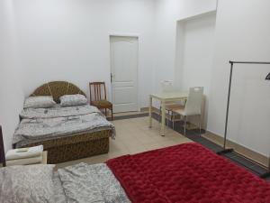 Postel nebo postele na pokoji v ubytování Старий Дворик,кімнати біля жд вокзалу