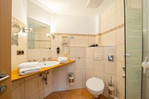 Koupelna v ubytování Berghotel & Chalets Adersberg Chiemgau Card kostenfrei