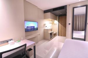 Postel nebo postele na pokoji v ubytování Prime Park Hotel & Convention Lombok