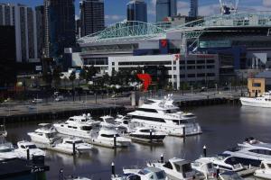 a bunch of boats are docked in a harbor at Docklands Private Collection - NEWQUAY in Melbourne