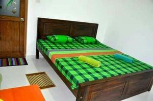 Letto o letti in una camera di Dinimuthu Rest Inn