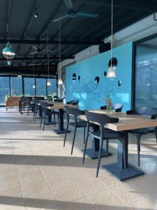a row of tables and chairs in a cafeteria at Lutai B&B in Yung-an-ts'un