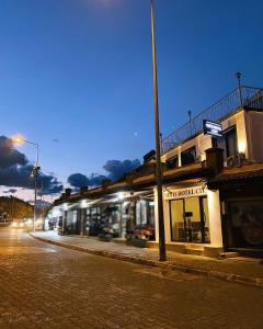 a building on a city street at night at Nefis Hotel City in Fethiye
