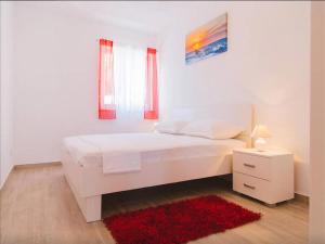 Posteľ alebo postele v izbe v ubytovaní House Karlo Apartments