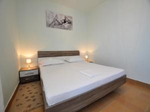 Posteľ alebo postele v izbe v ubytovaní House Karlo Apartments